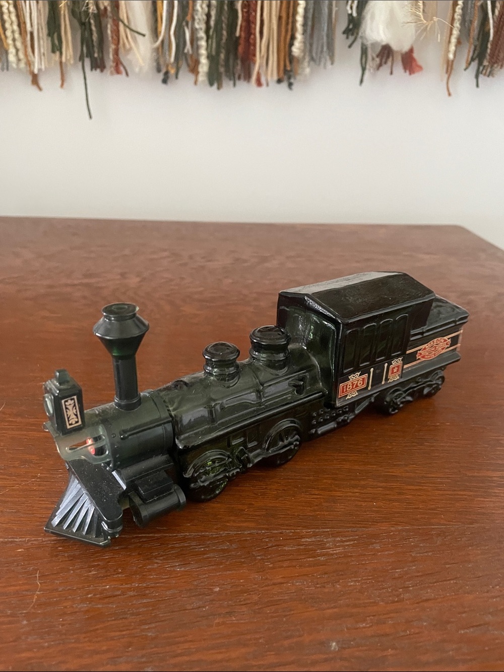 Avon dark green train cologne bottle